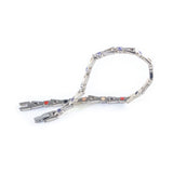 Evermore bracelet unclasped and folded to display interlocking links and crystal accents.