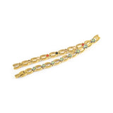 Grandeur bracelet unclasped and folded to display interlocking links and green crystal accents.