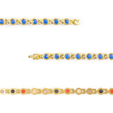 Close-up of Blue Belle bracelet showing round royal blue crystal set in each gold link.