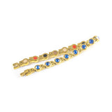 Blue Belle bracelet unclasped and folded to display gold links with royal blue crystals.