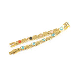 Celeste bracelet unclasped and folded to display alternating crystal and polished gold heart pattern.