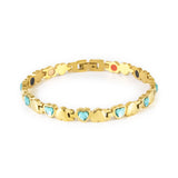 Celeste gold-plated stainless steel bracelet with blue crystals clasped front view, heart-link design.