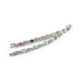 Cherish bracelet unclasped and folded to display alternating gold-set crystal and polished heart pattern.