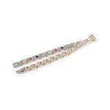 Continuum negative ion bracelet with stainless steel and rose gold, unclasped and folded for display.