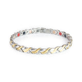 Duet bracelet in stainless steel and gold-plated dual-tone design with flowing wave-shaped links and embedded negative ion elements.