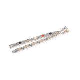 Flutter negative ion bracelet with stainless steel and rose gold, unclasped and folded for display.