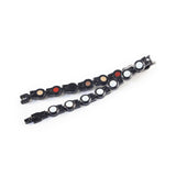 Bracelet folded and unclasped to showcase white crystals and link design.