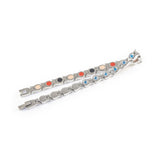 Glide bracelet unclasped and folded to display link design and crystal accents.