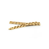 Golden Breath bracelet unclasped and folded to display detailed gold-plated links and elegant craftsmanship.