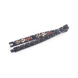 Horizon bracelet unclasped and folded to display polished black links.