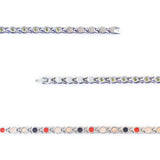 Close-up view of stainless steel links with green crystal accents and fine detailing.