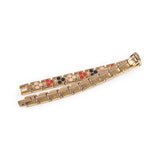 Nebula bracelet unclasped and folded to display interlocking rose gold link design.