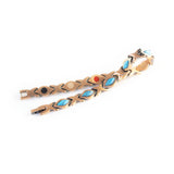 Sierra negative ion copper bracelet with turquoise, unclasped and folded for display.