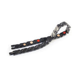 Strider negative ion bracelet with matte black stainless steel, unclasped and folded for display.