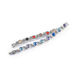 Symphony bracelet unclasped and folded to display polished steel links with crystals.