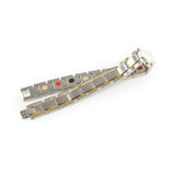 Vanguard negative ion bracelet with stainless steel and gold, unclasped and folded for display.